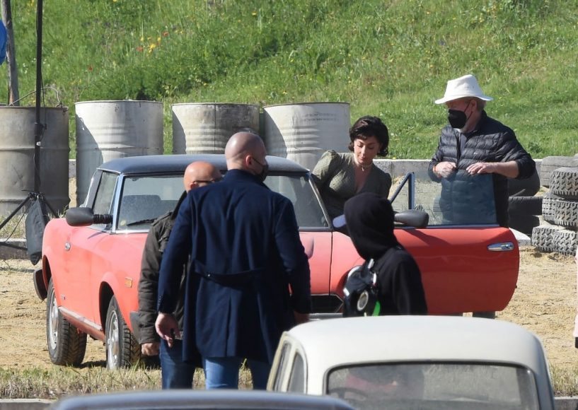 Lady Gaga filming House of Gucci in a red Fiat Spider on April 21, 2021 in Rome