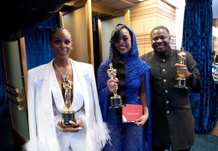 Tiara Thomas, Dernst Emile II, and H.E.R. pose backstage with the Oscar® for Original Song during the 93rd Annual Academy Awards at Union Station on April 25, 2021 in Los Angeles