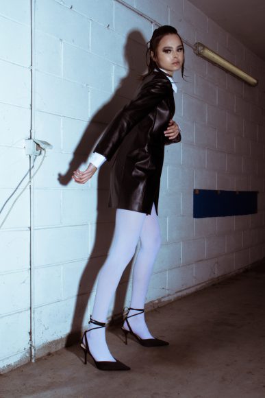 Leather Jacket: Francesca Cottone
White Shirt: Francesca Cottone
Tights: Stylist’s own
Heeled Sandals: Stylist’s own