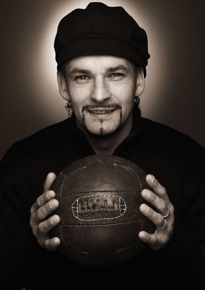 Roberto Baggio, striker for Brescia and the Italian national team, holding an old fashioned leather football, 5th December 2003